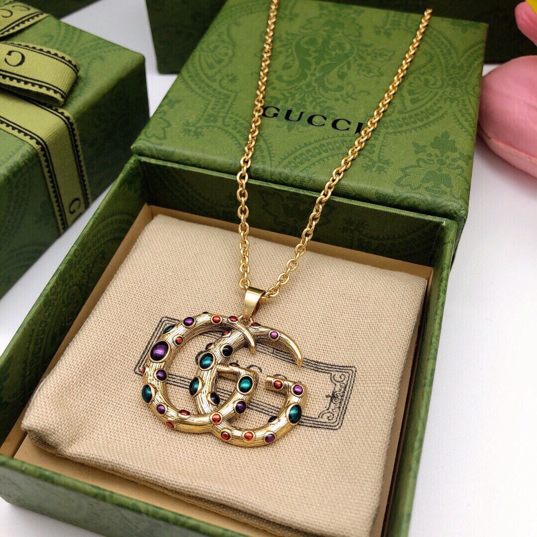 Martin Graham pendant necklace in polished metal-tone – detail view