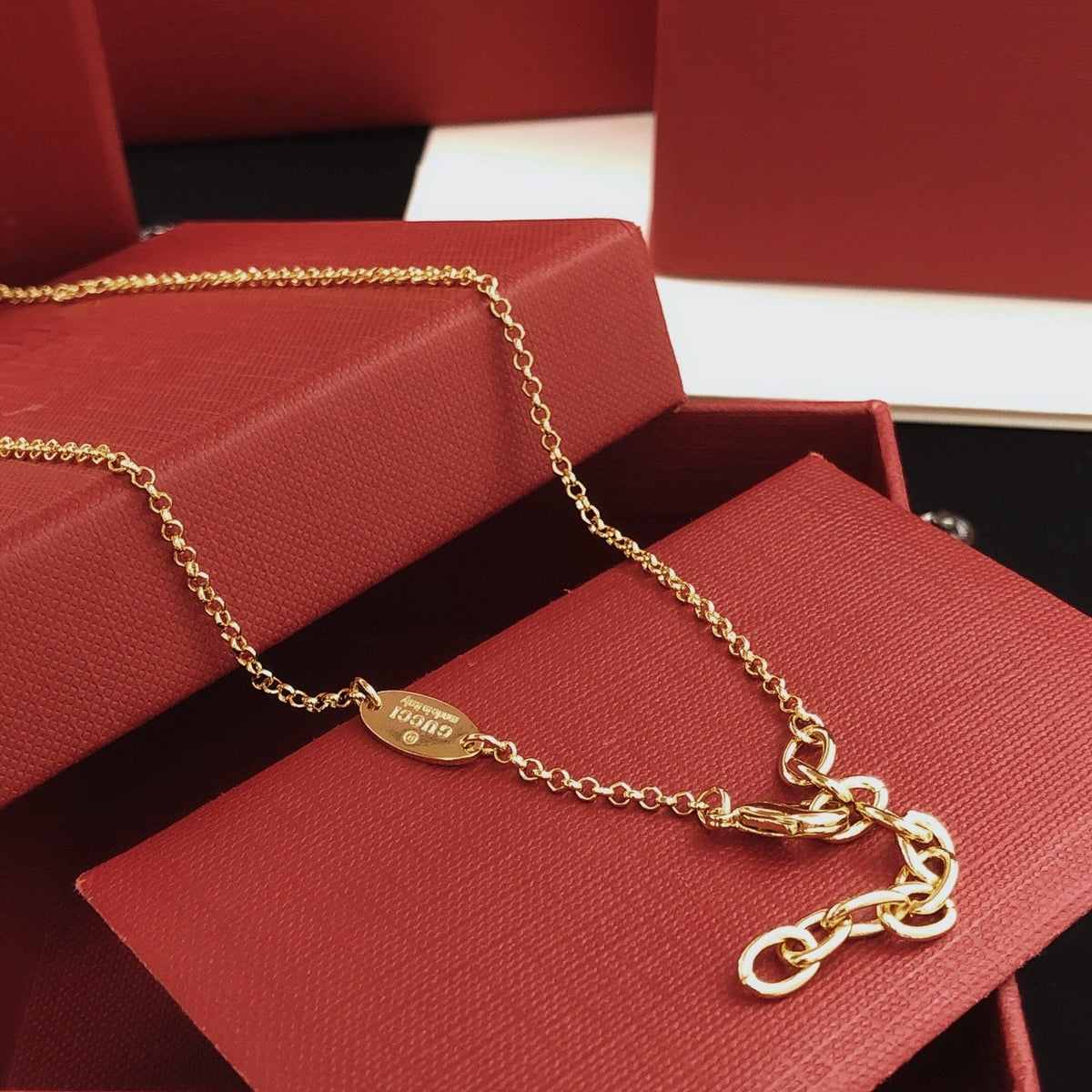 Martin Graham pendant necklace in polished metal-tone – side detail