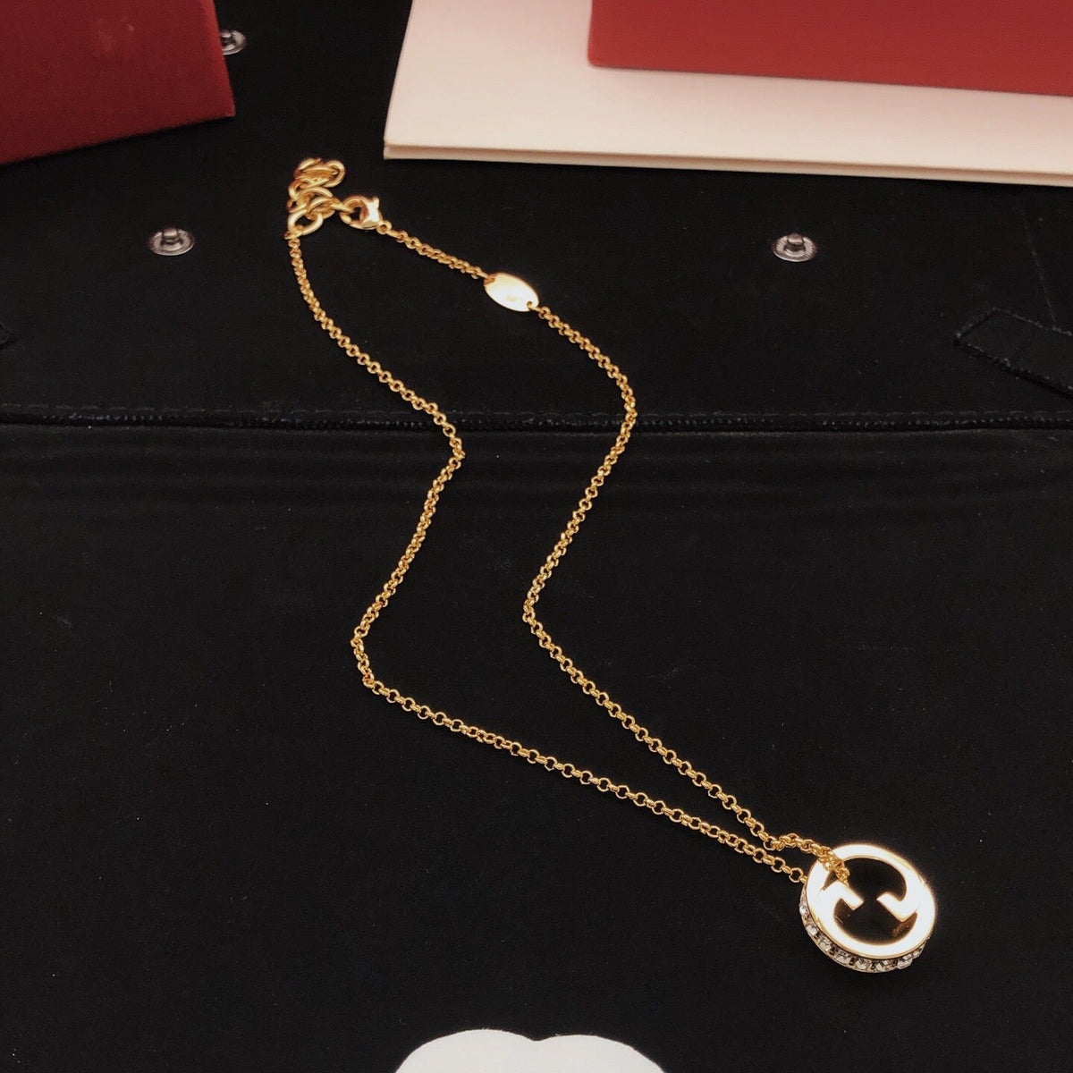 Martin Graham pendant necklace in polished metal-tone – detail view