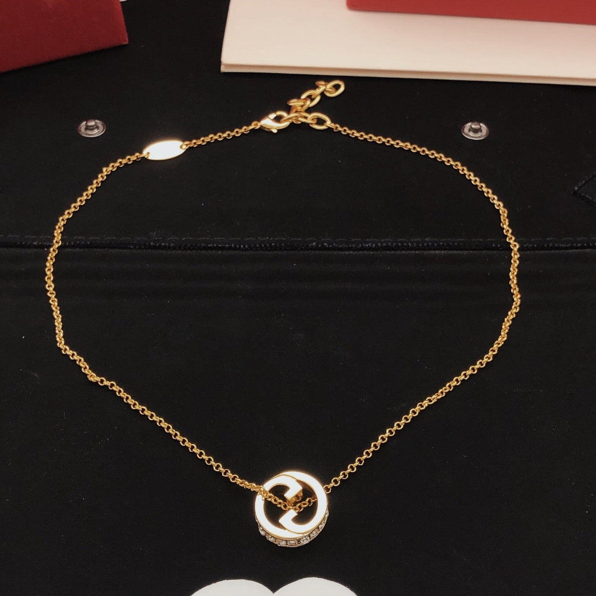 Martin Graham pendant necklace in polished metal-tone – close-up detail