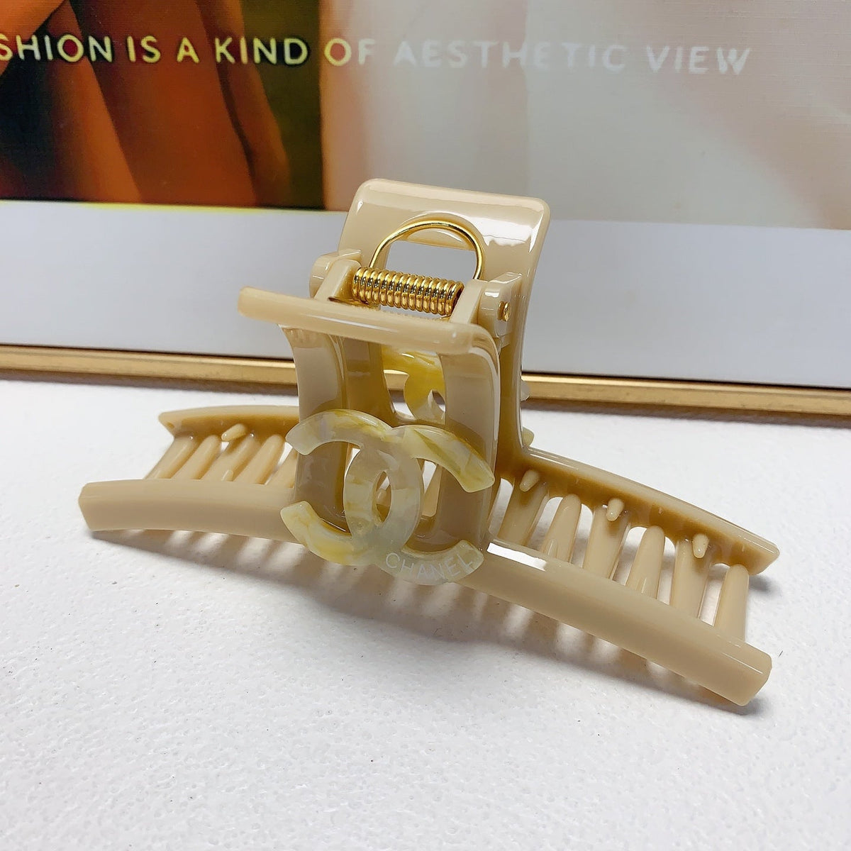 Martin Graham hair accessory in polished metal-tone – close-up detail