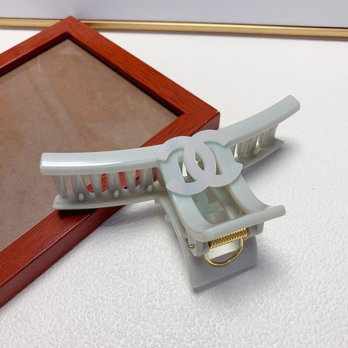 Martin Graham hair accessory in polished metal-tone – styled product view