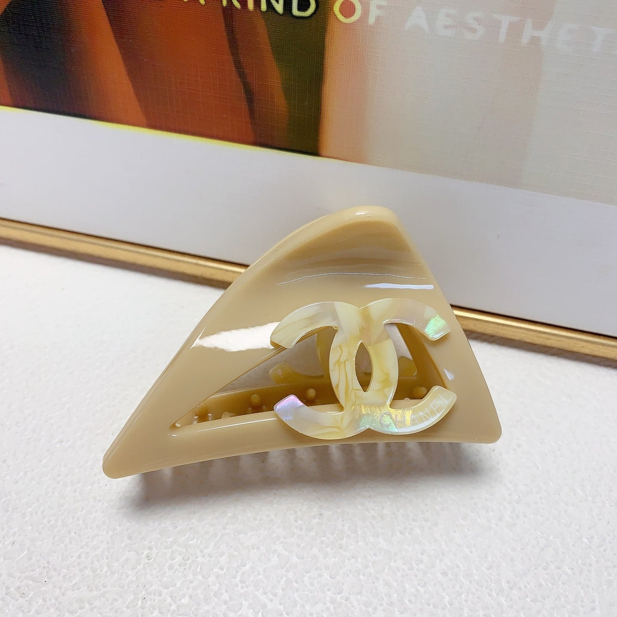 Martin Graham hair accessory in polished metal-tone – close-up detail