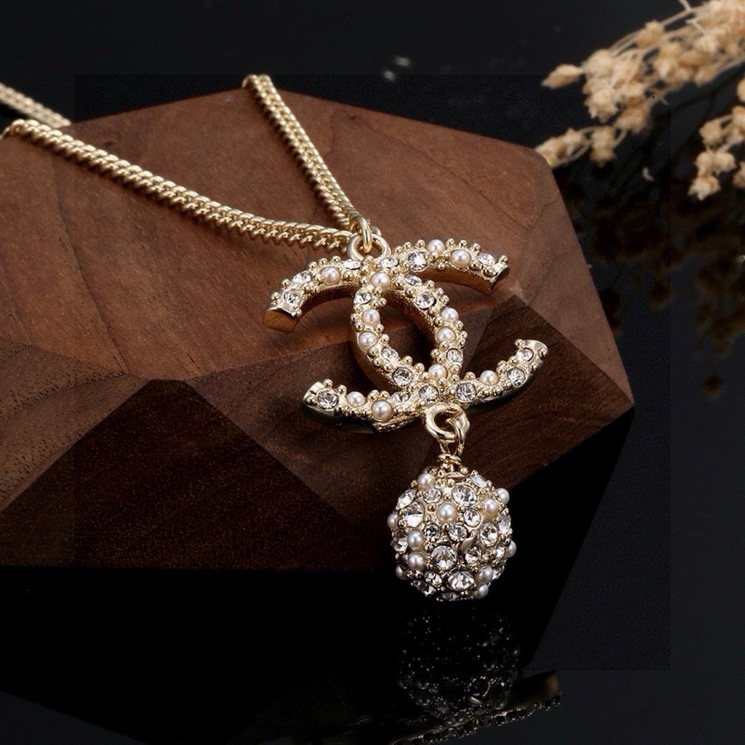 Martin Graham pendant necklace in polished metal-tone – styled product view