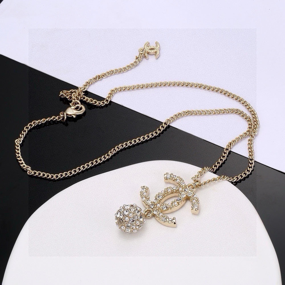 Martin Graham pendant necklace in polished metal-tone – detail view