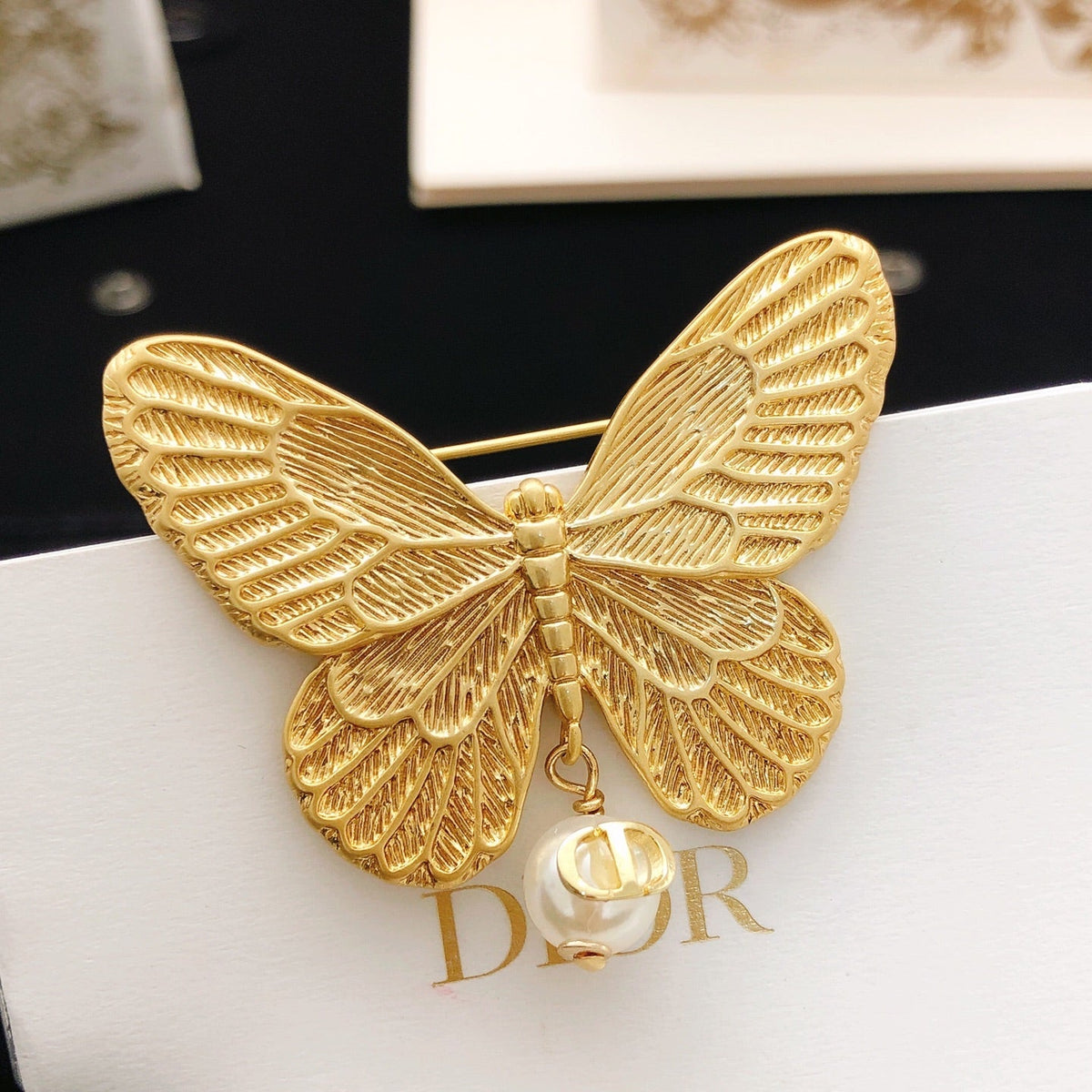 Martin Graham brooch in polished metal-tone