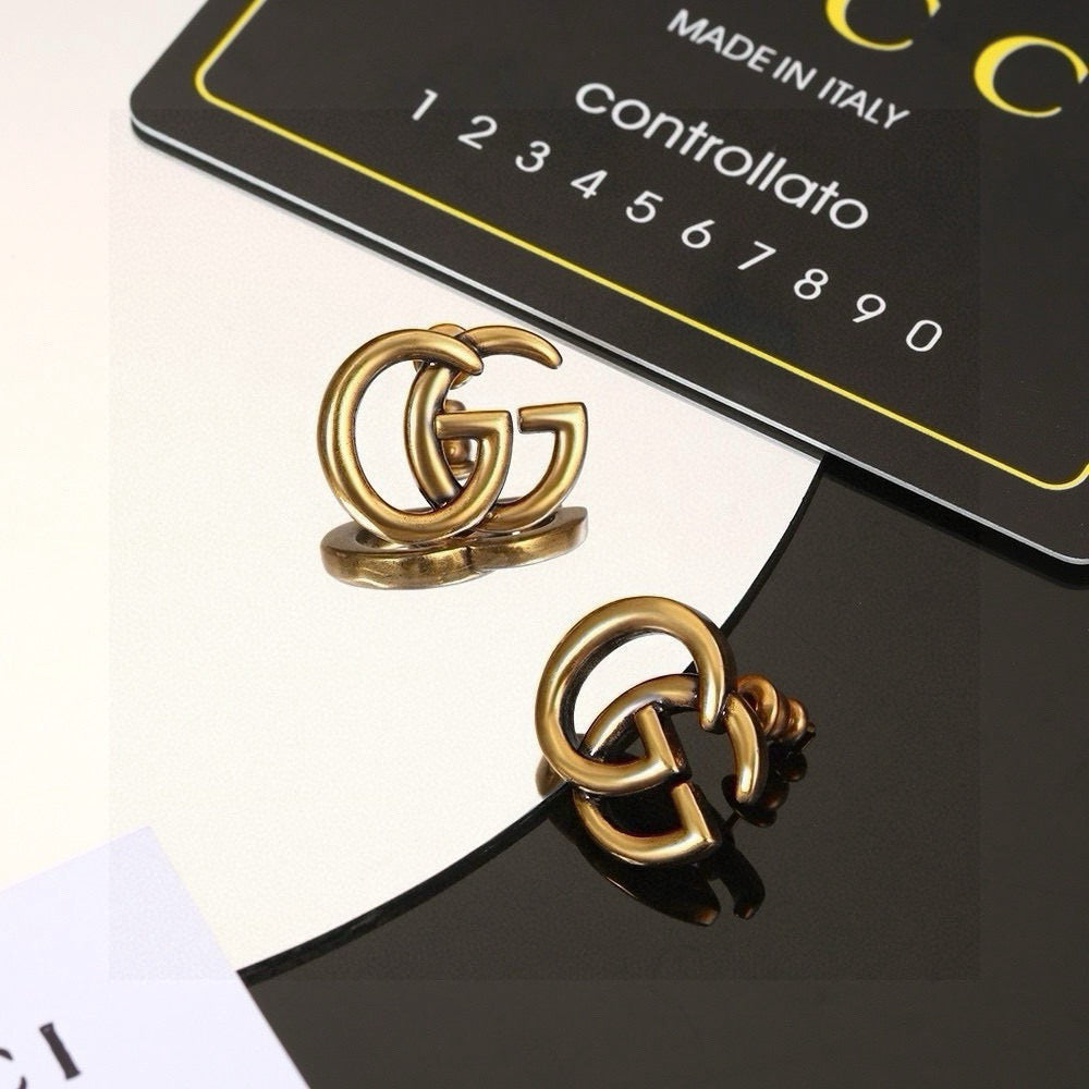 Martin Graham stud earrings in polished metal-tone – main product view