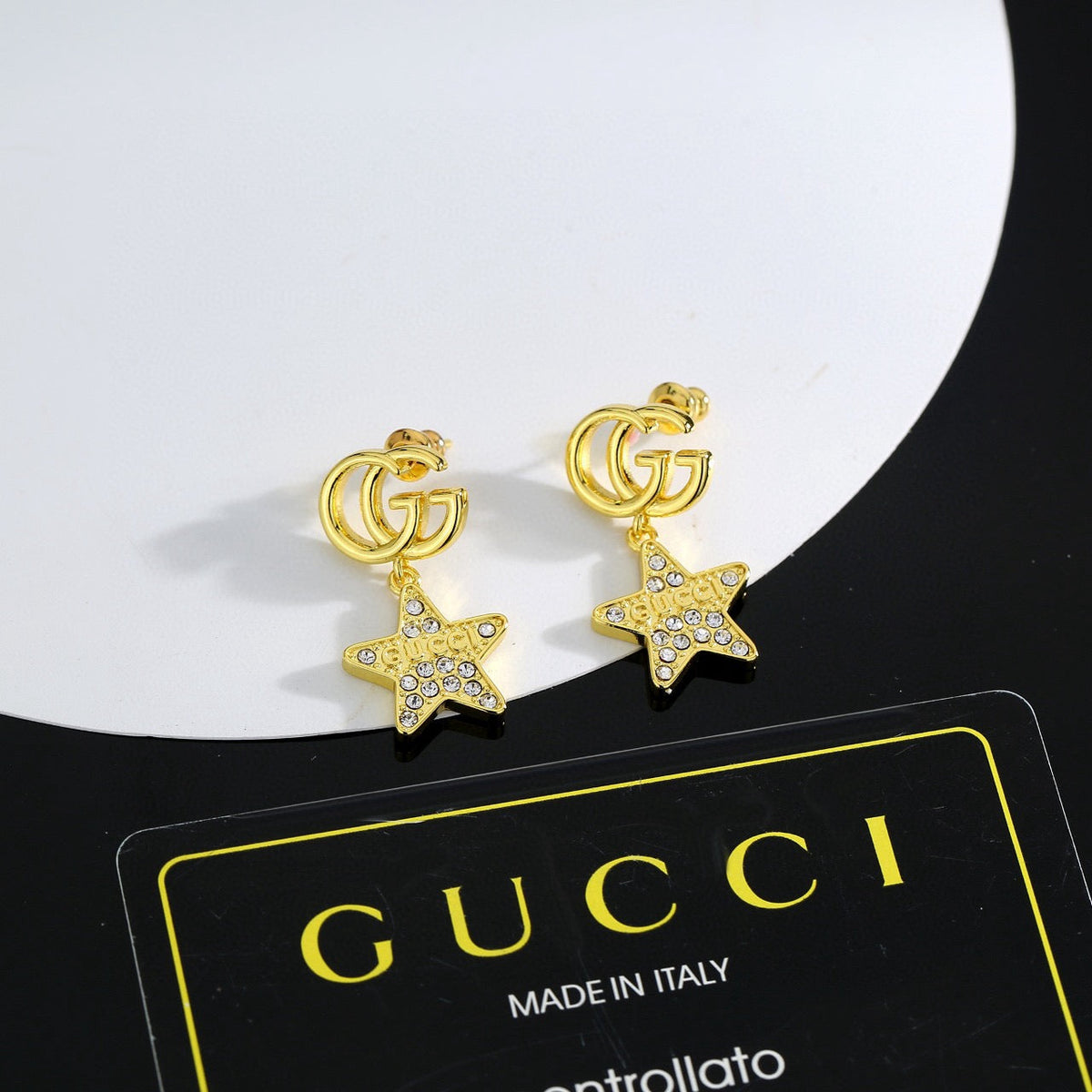 Martin Graham stud earrings in polished metal-tone – detail view