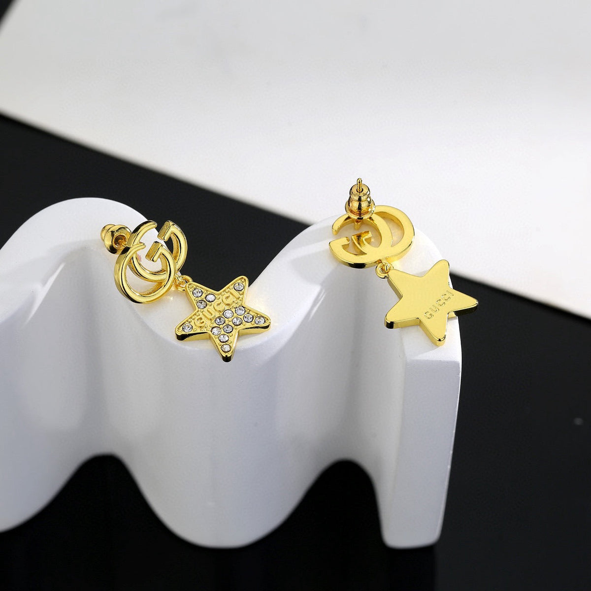 Martin Graham stud earrings in polished metal-tone – front product view