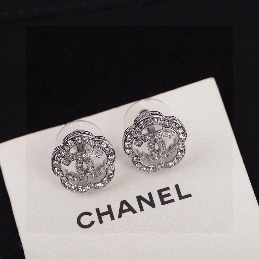 Martin Graham stud earrings in polished metal-tone – styled product view