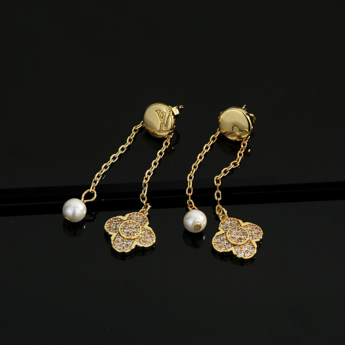 Martin Graham stud earrings in polished metal-tone – front product view