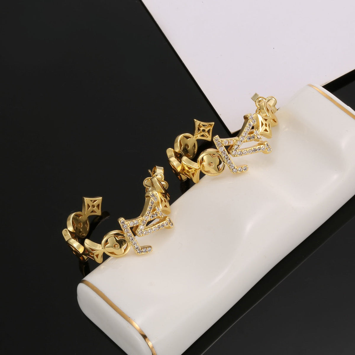 Martin Graham stud earrings in polished metal-tone – styled product view