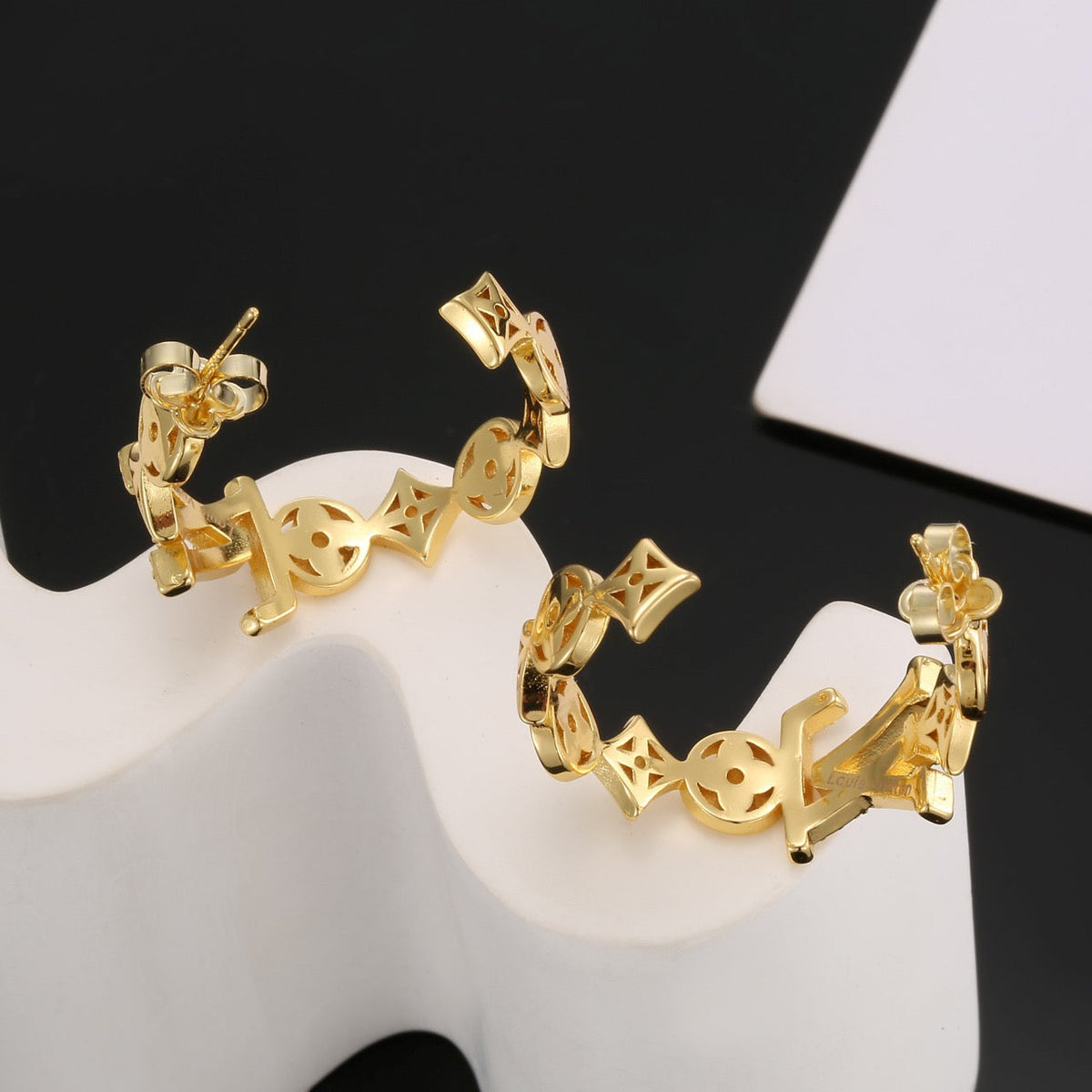 Martin Graham stud earrings in polished metal-tone – front product view
