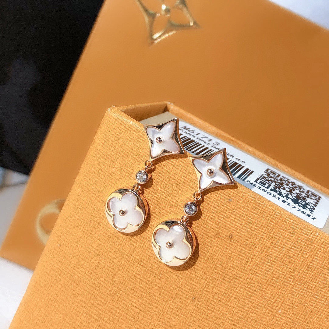 Martin Graham stud earrings in polished metal-tone – close-up detail