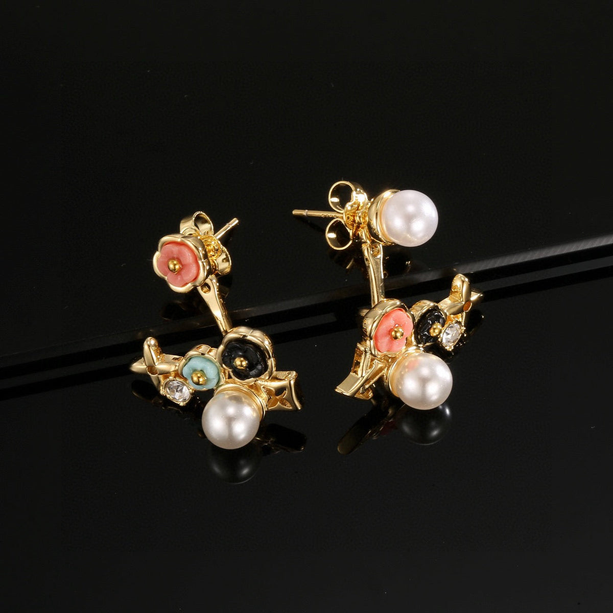 Martin Graham stud earrings in polished metal-tone – side detail
