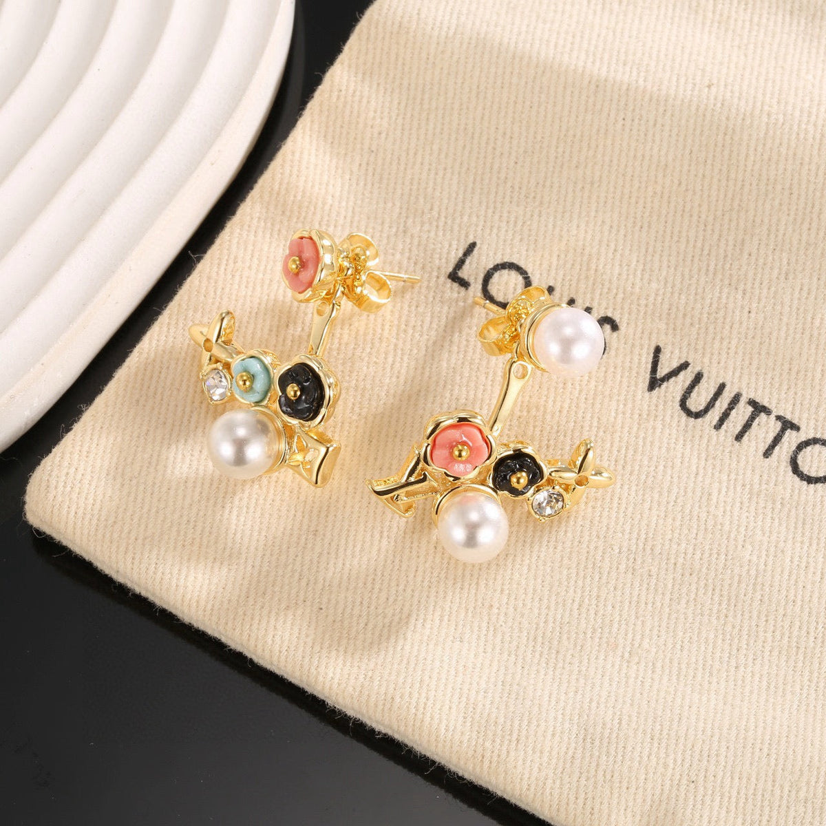 Martin Graham stud earrings in polished metal-tone – front product view