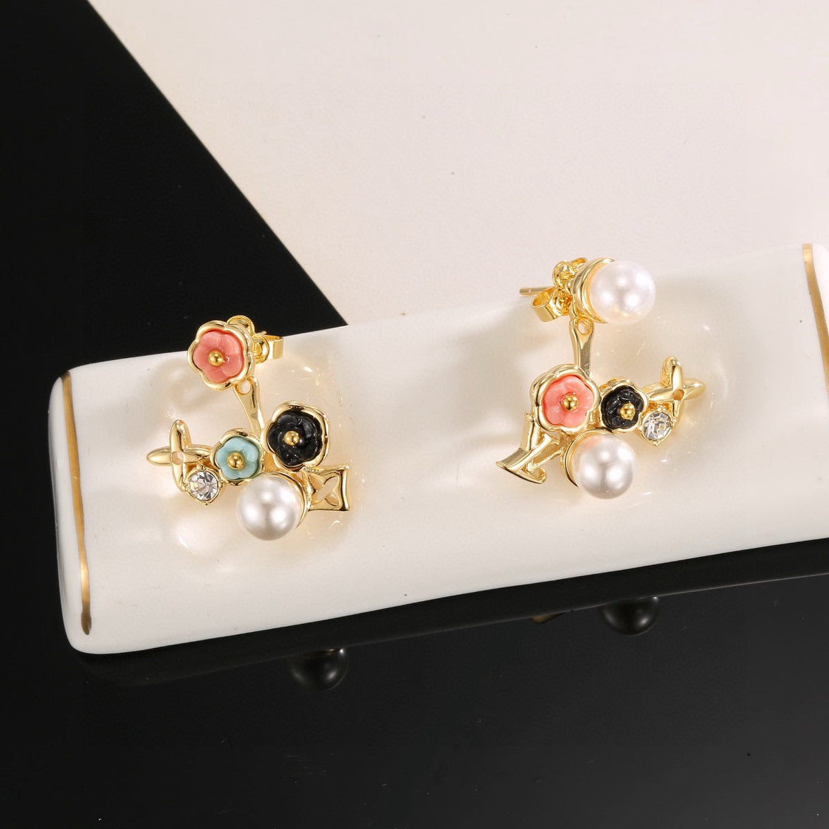 Martin Graham stud earrings in polished metal-tone – styled product view