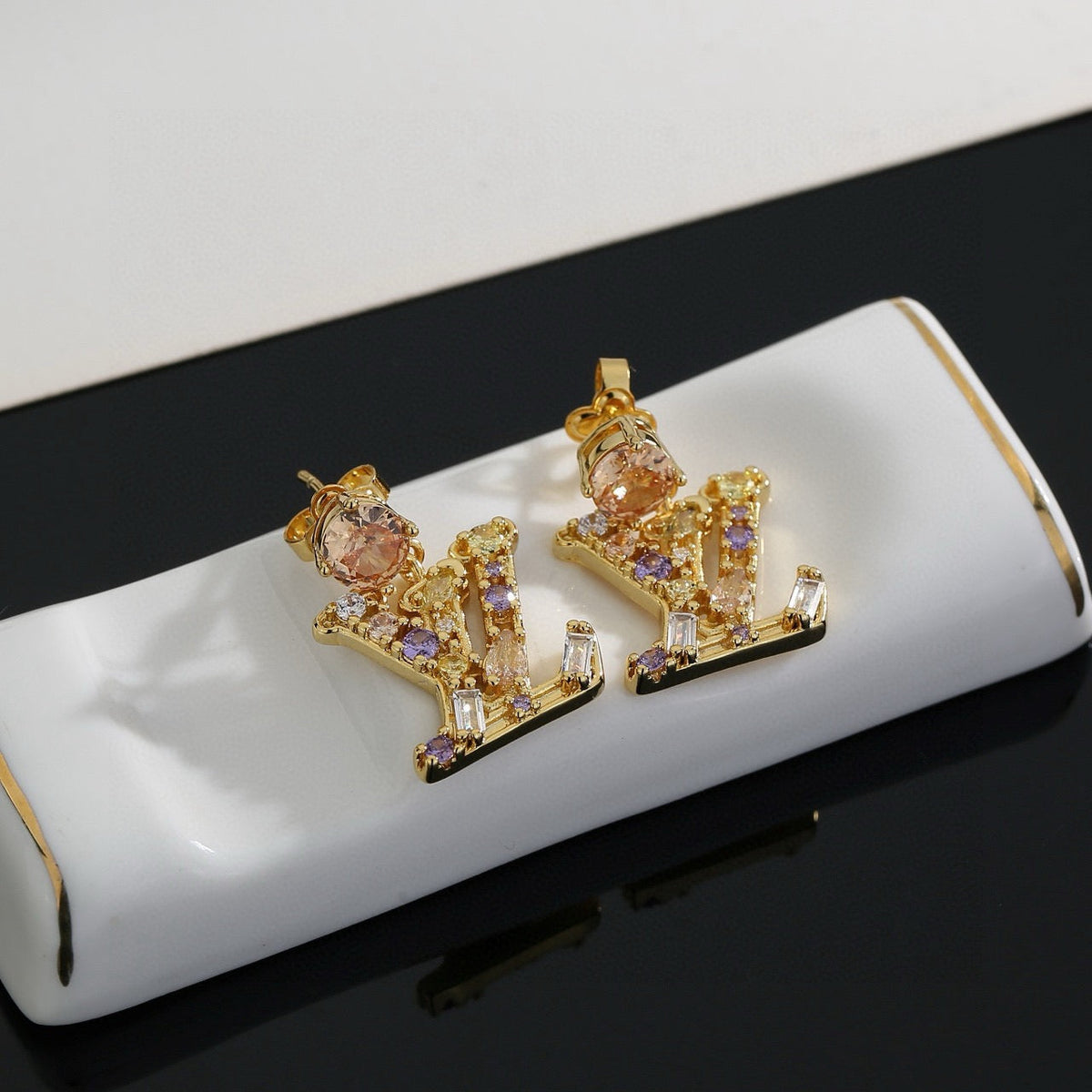 Martin Graham stud earrings in polished metal-tone – side detail