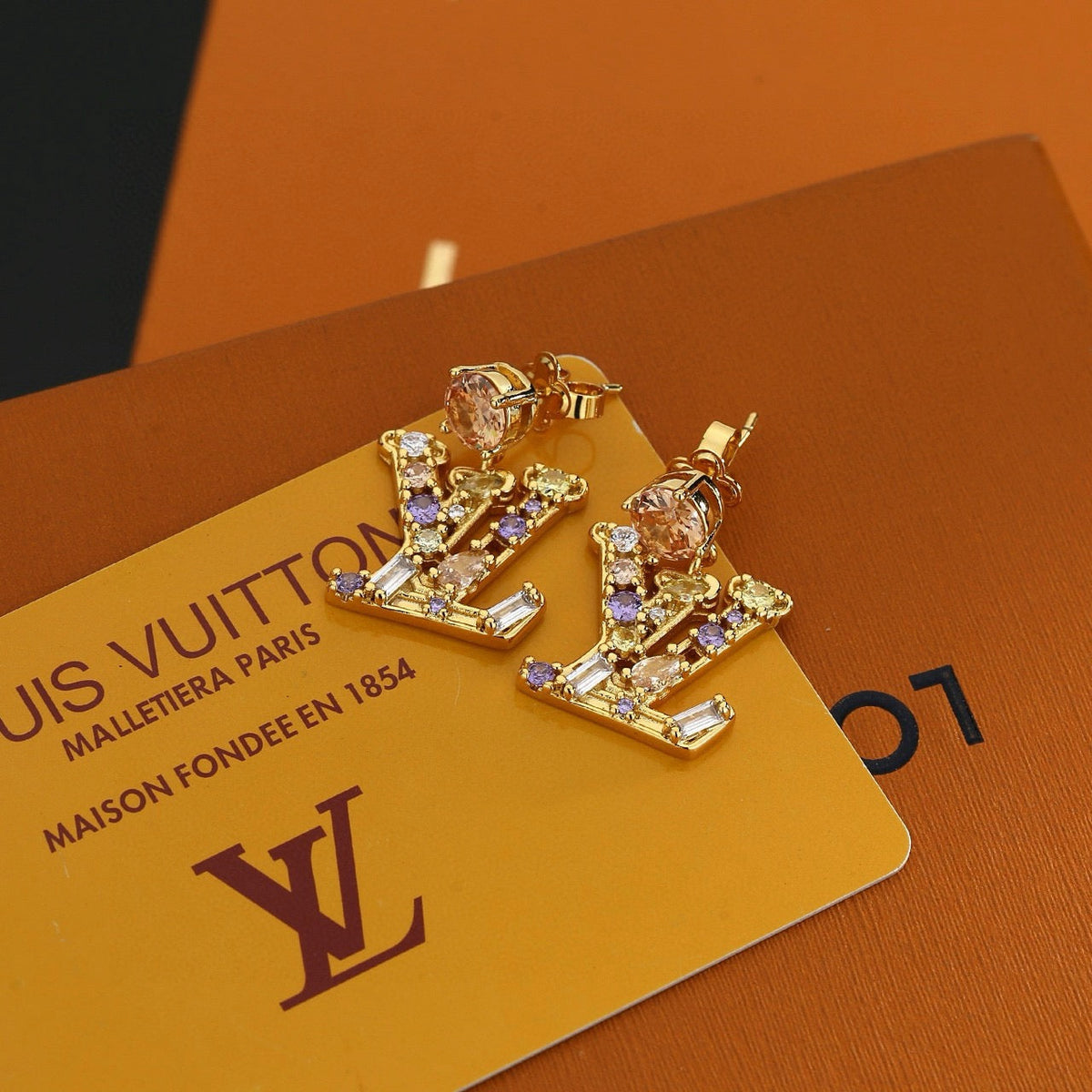 Martin Graham stud earrings in polished metal-tone – front product view