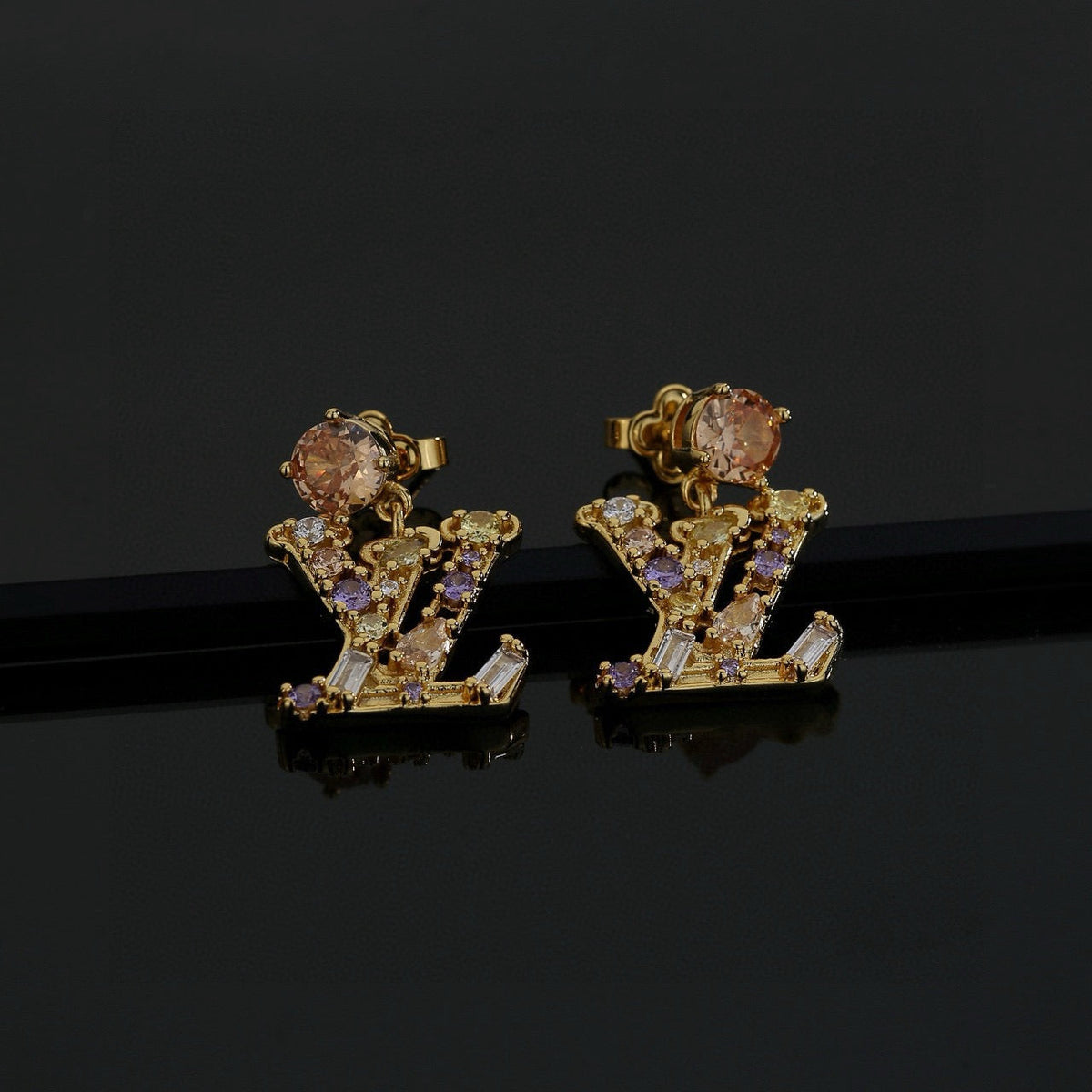 Martin Graham stud earrings in polished metal-tone – detail view