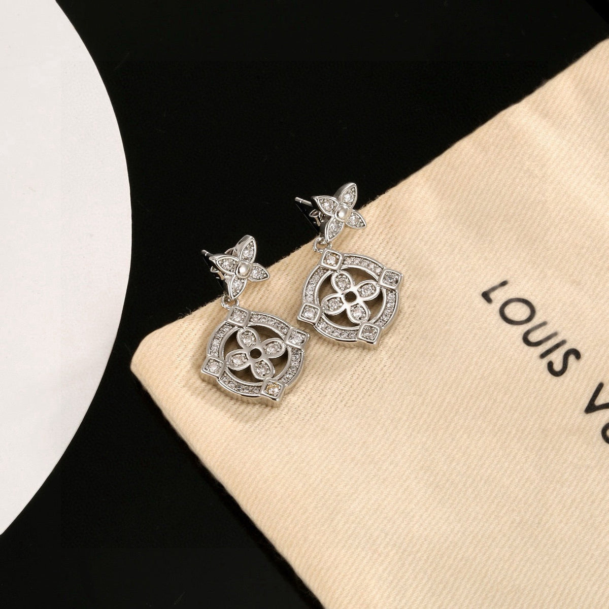 Martin Graham stud earrings in polished metal-tone – detail view