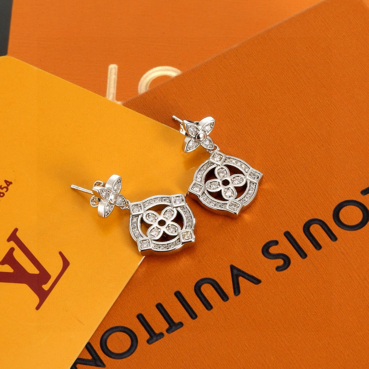 Martin Graham stud earrings in polished metal-tone – front product view