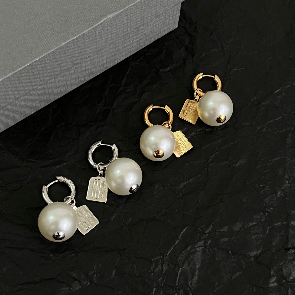 Martin Graham earrings in polished metal-tone – front product view