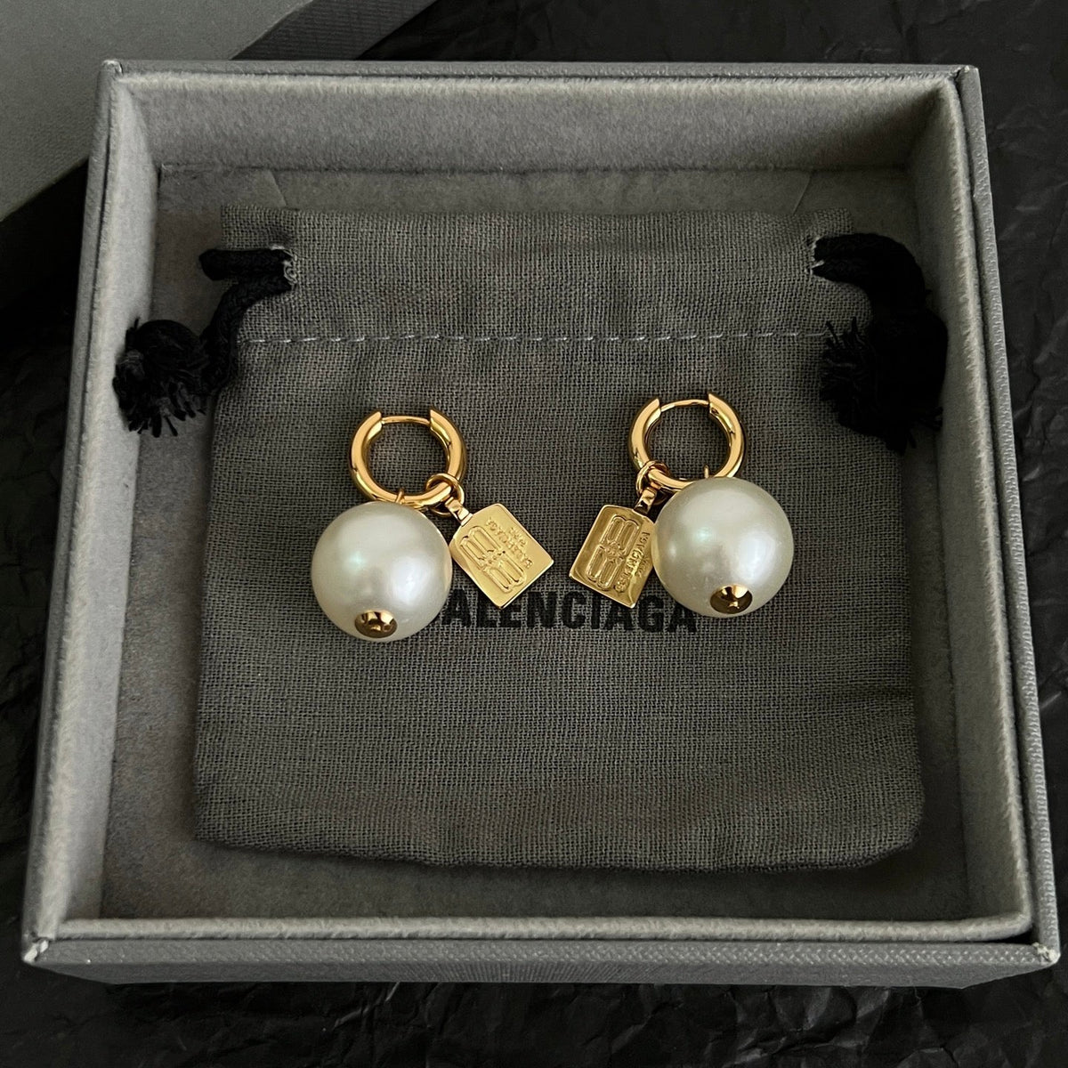 Martin Graham earrings in polished metal-tone – side detail