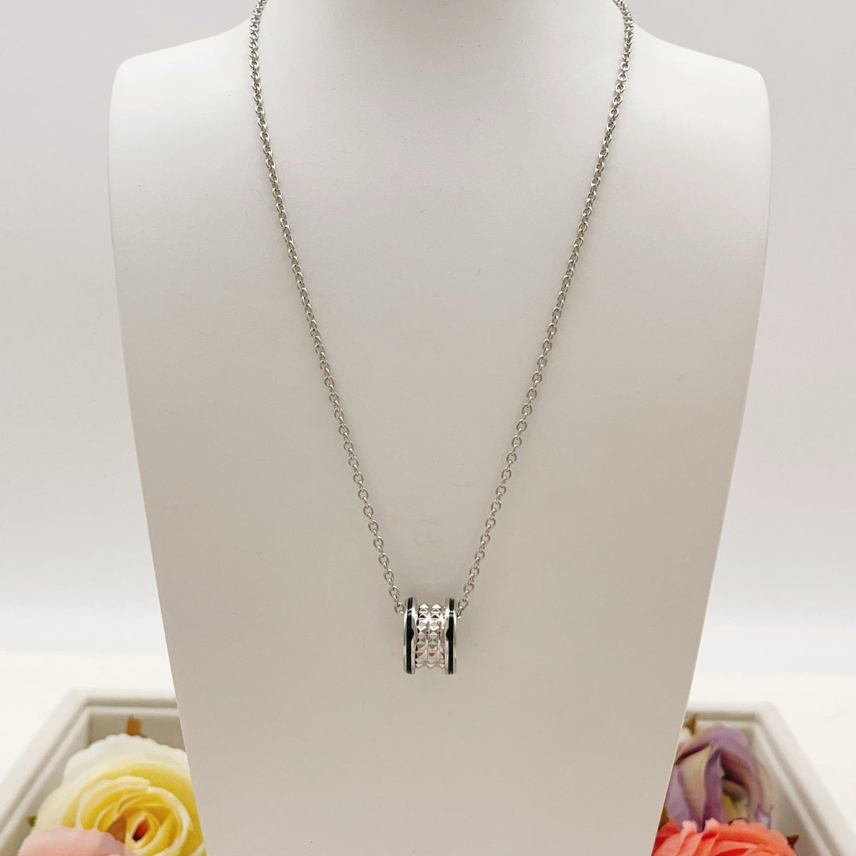 Martin Graham pendant necklace in polished metal-tone – close-up detail