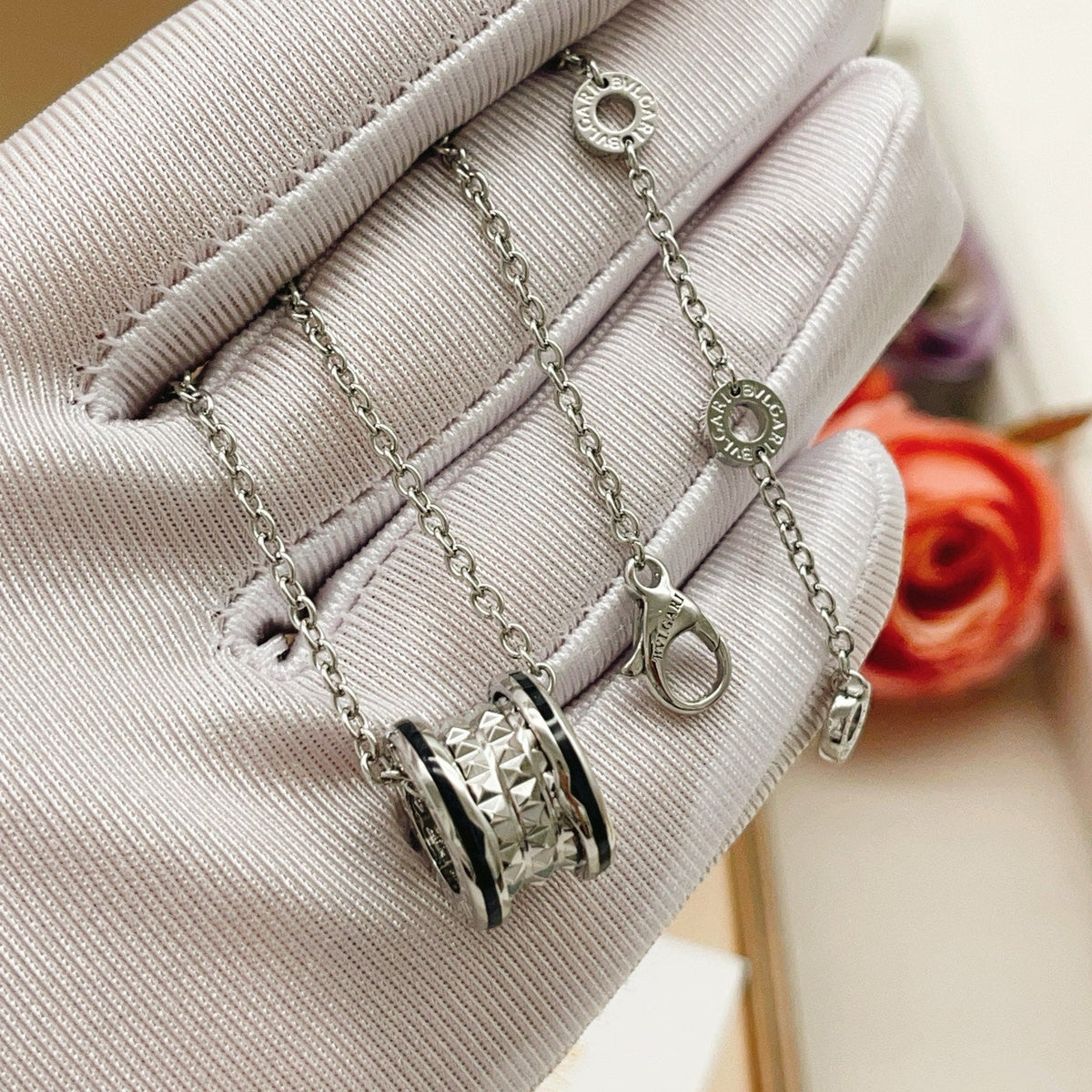 Martin Graham pendant necklace in polished metal-tone – side detail
