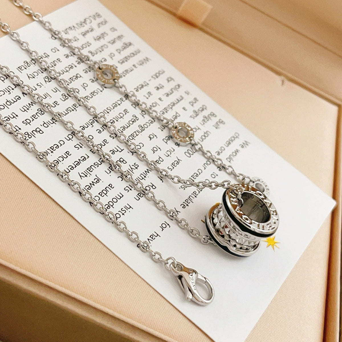 Martin Graham pendant necklace in polished metal-tone – detail view