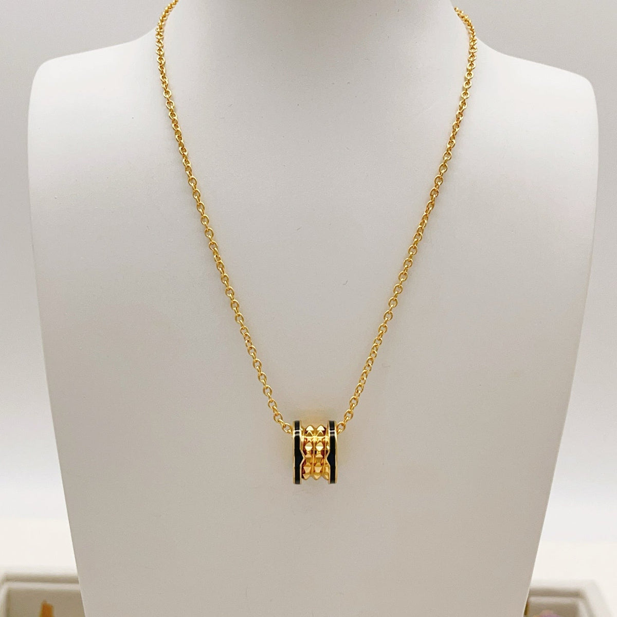 Martin Graham pendant necklace in polished metal-tone – close-up detail