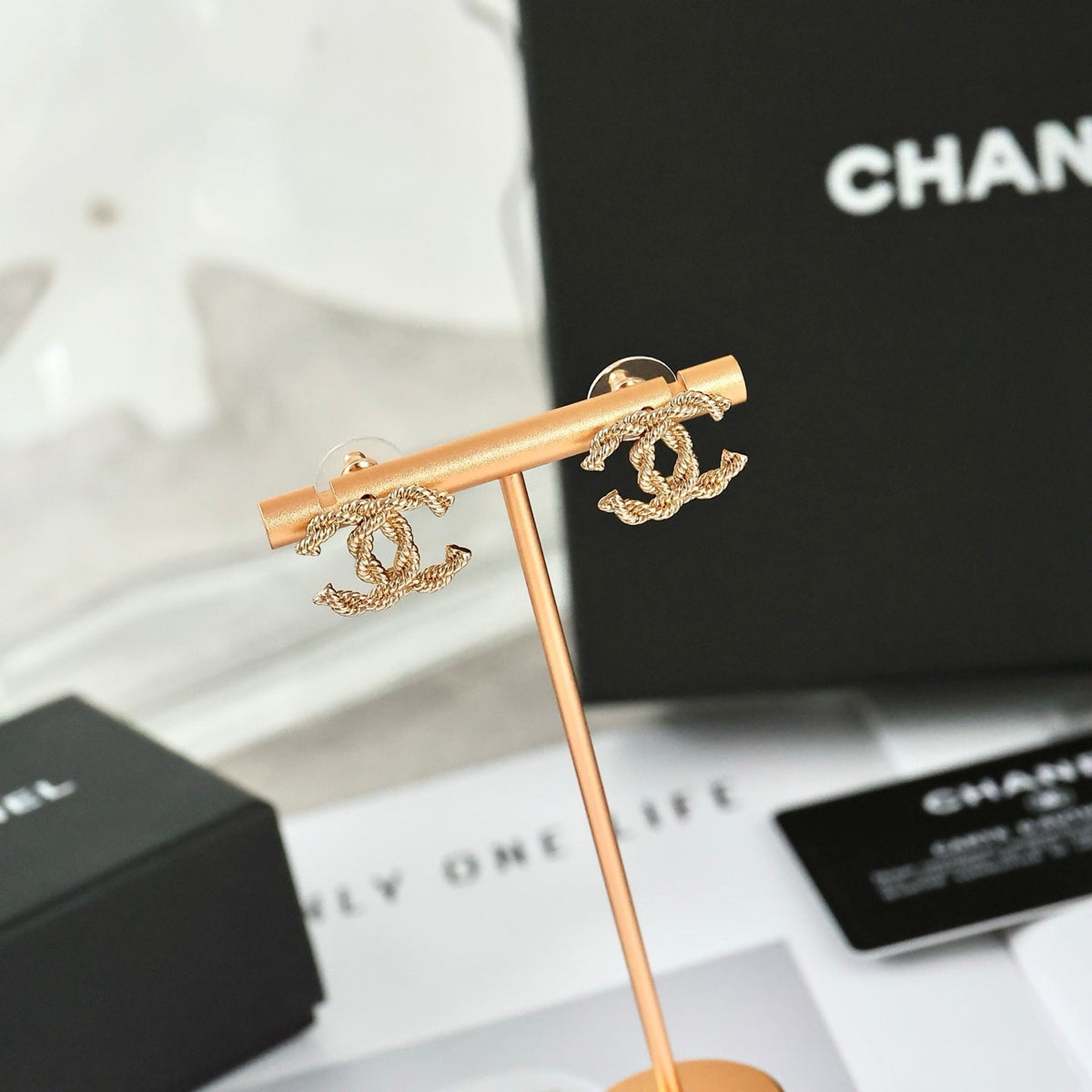 Martin Graham stud earrings in polished metal-tone – front product view