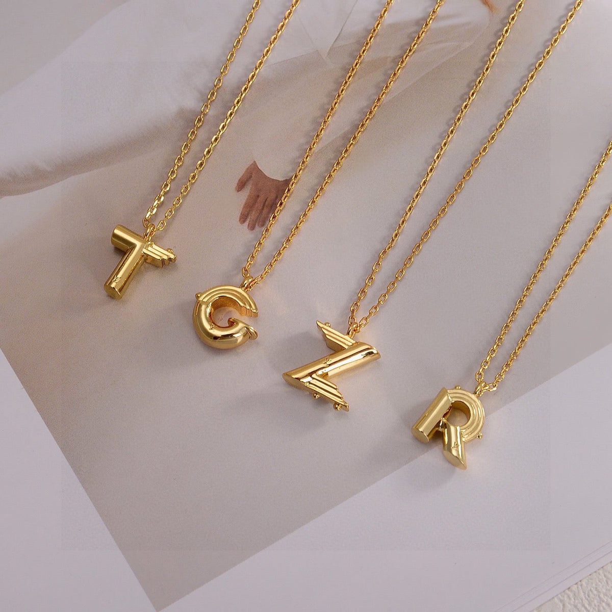 Martin Graham pendant necklace in polished metal-tone – detail view