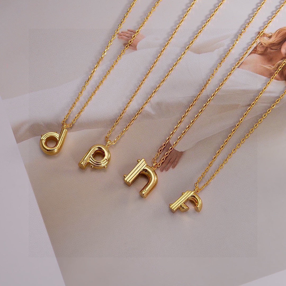 Martin Graham pendant necklace in polished metal-tone – front product view