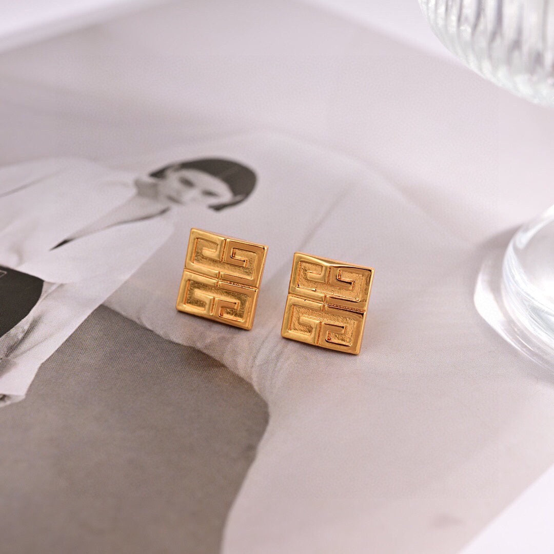 Martin Graham stud earrings in polished metal-tone