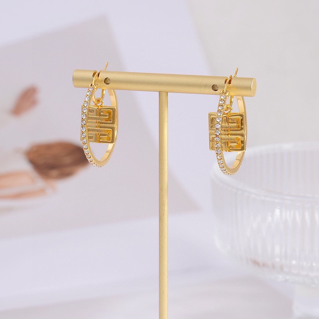 Martin Graham earrings in polished metal-tone – close-up detail