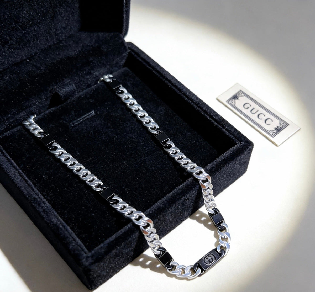 Martin Graham pendant necklace in polished metal-tone – close-up detail