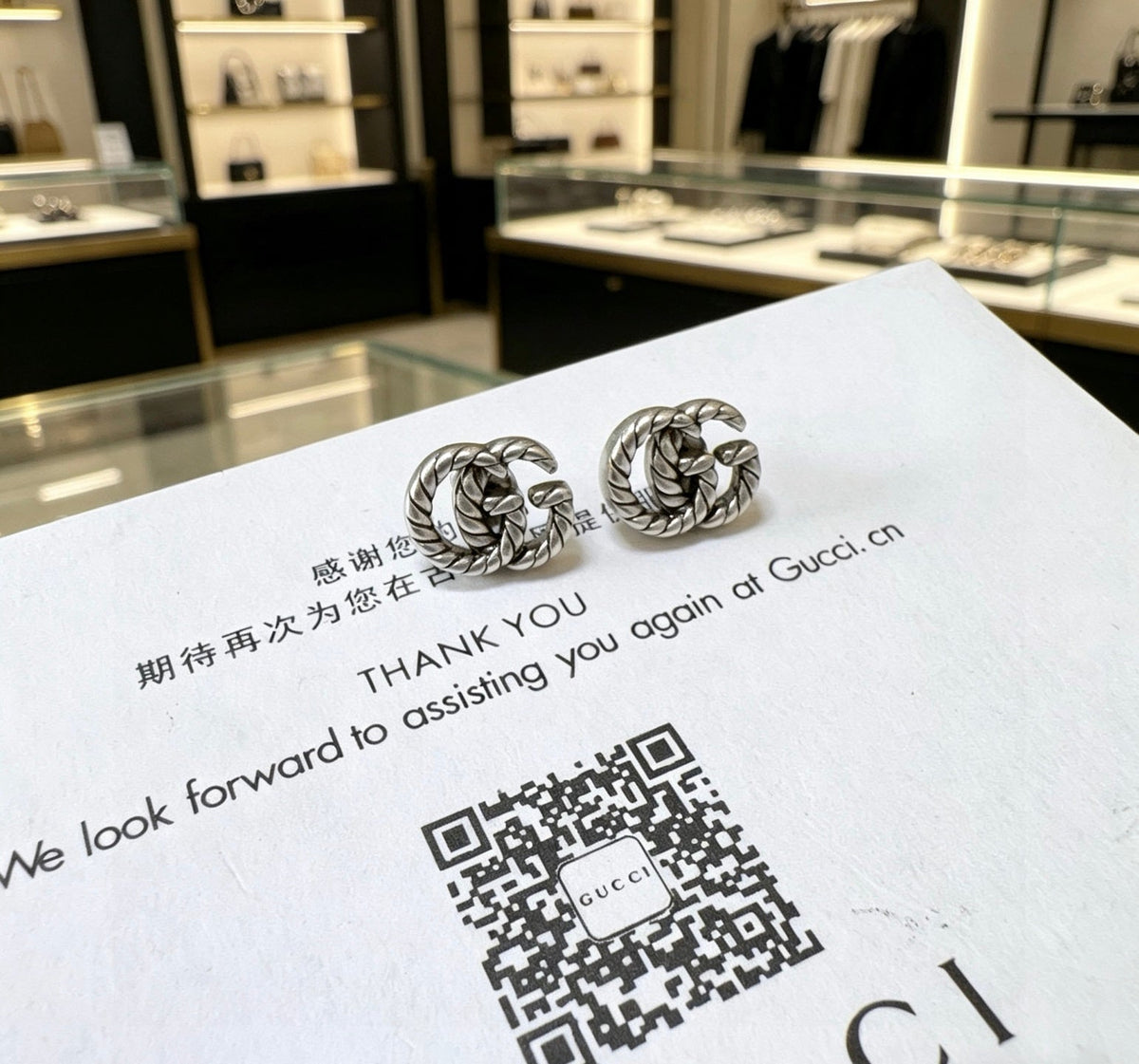 Martin Graham stud earrings in polished metal-tone – front product view