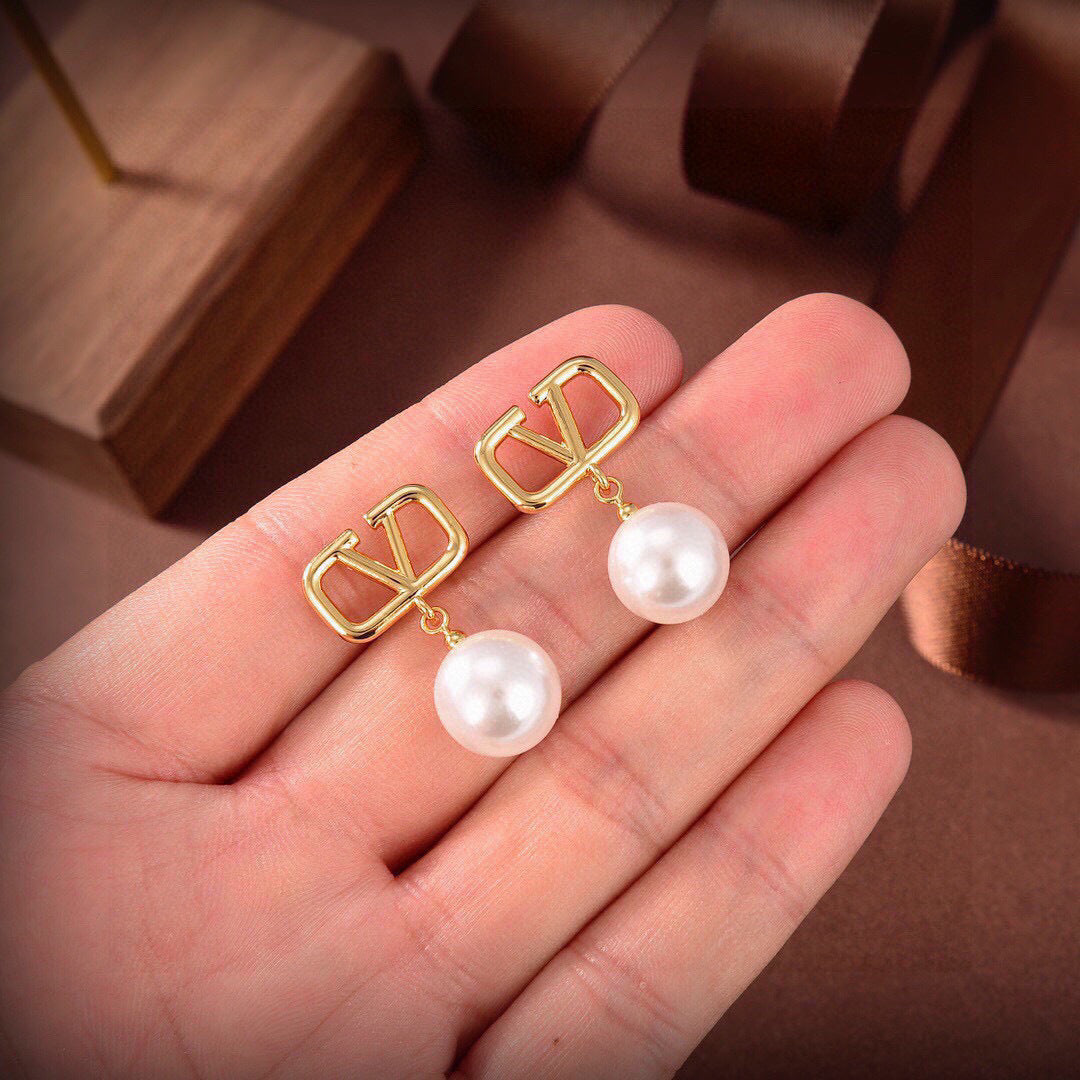 Martin Graham stud earrings in polished metal-tone