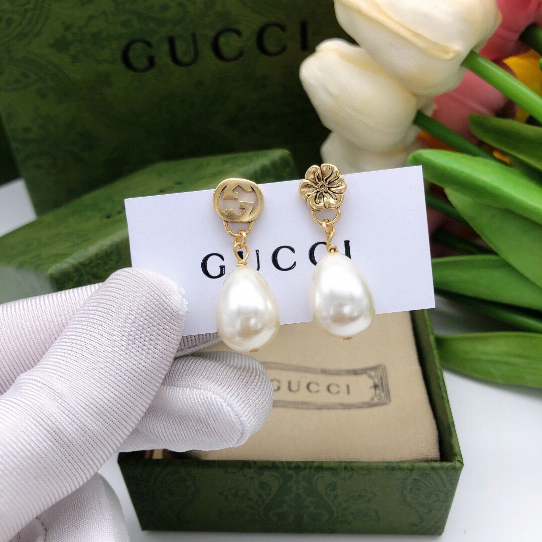Martin Graham earrings in polished metal-tone – front product view