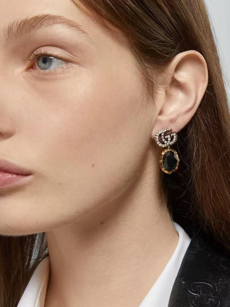 Martin Graham stud earrings in polished metal-tone – side detail