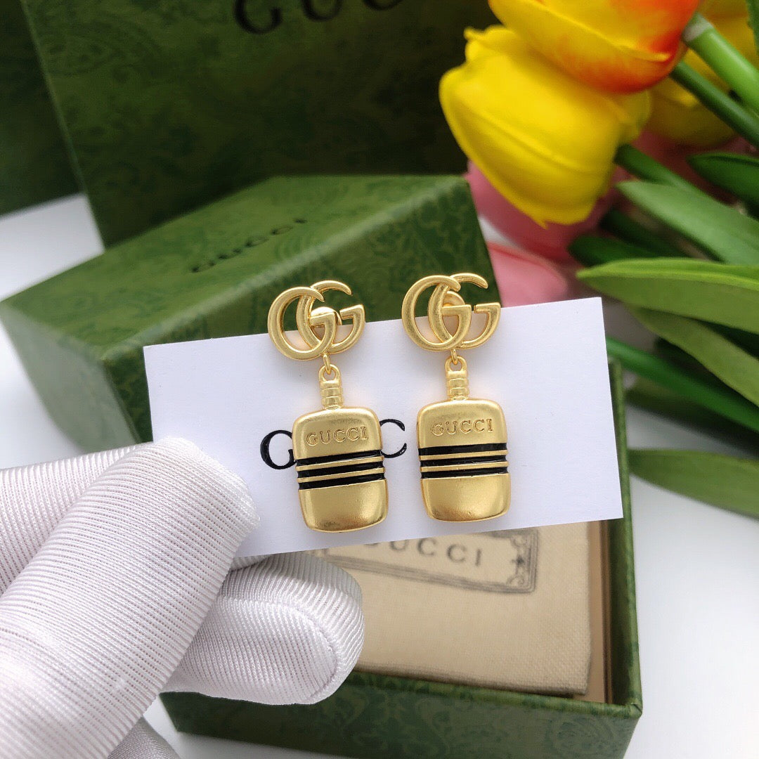 Martin Graham stud earrings in polished metal-tone – front product view