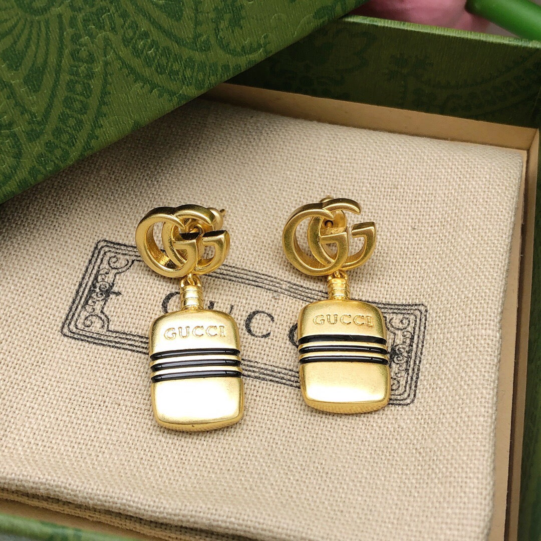 Martin Graham stud earrings in polished metal-tone – detail view