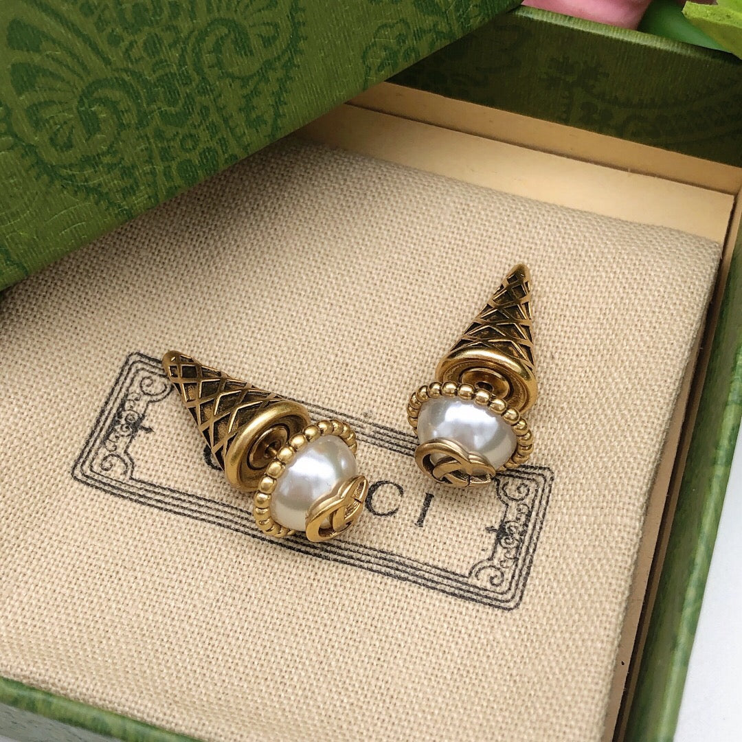Martin Graham stud earrings in polished metal-tone – detail view