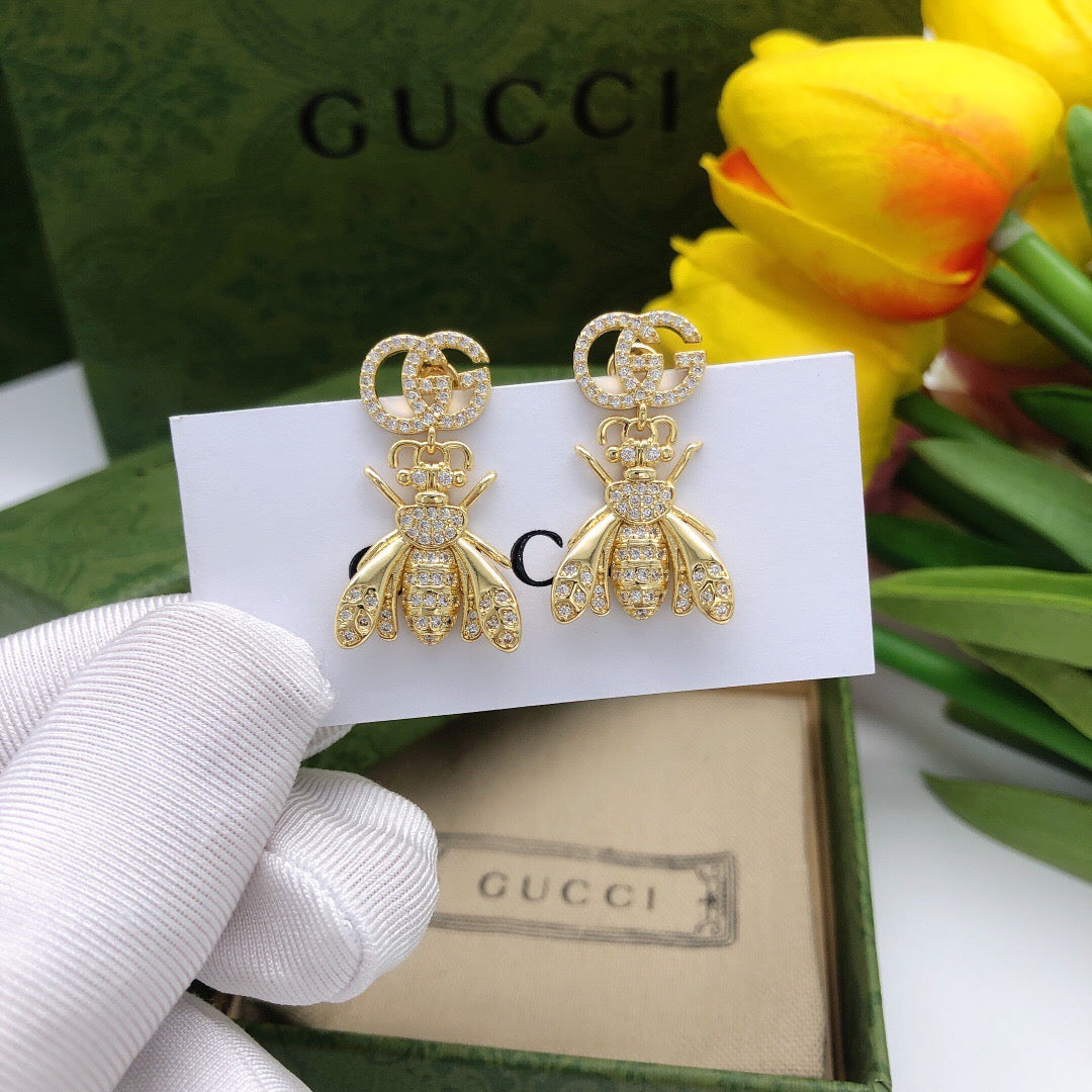 Martin Graham earrings in polished metal-tone – front product view