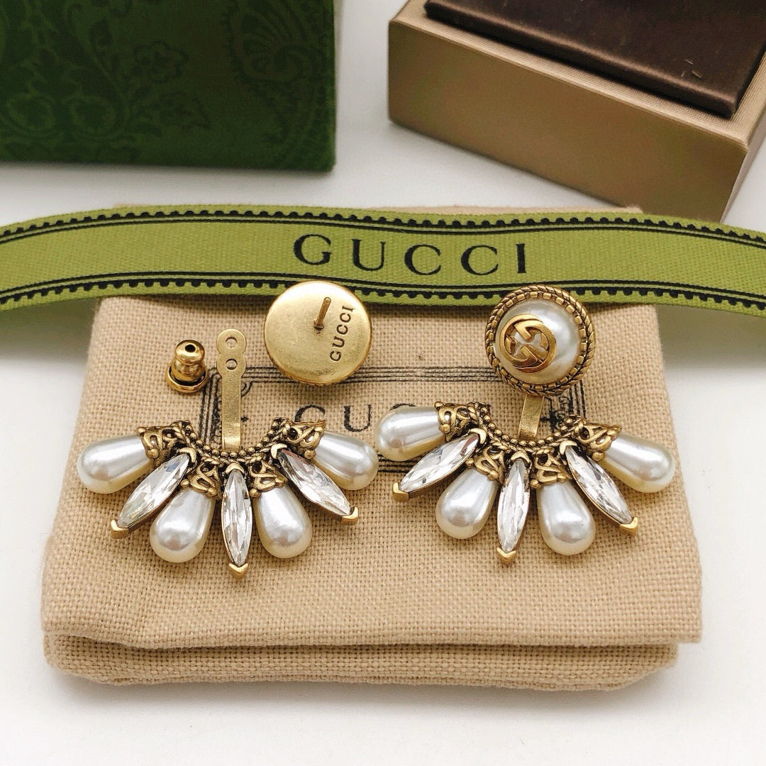Martin Graham stud earrings in polished metal-tone – styled product view