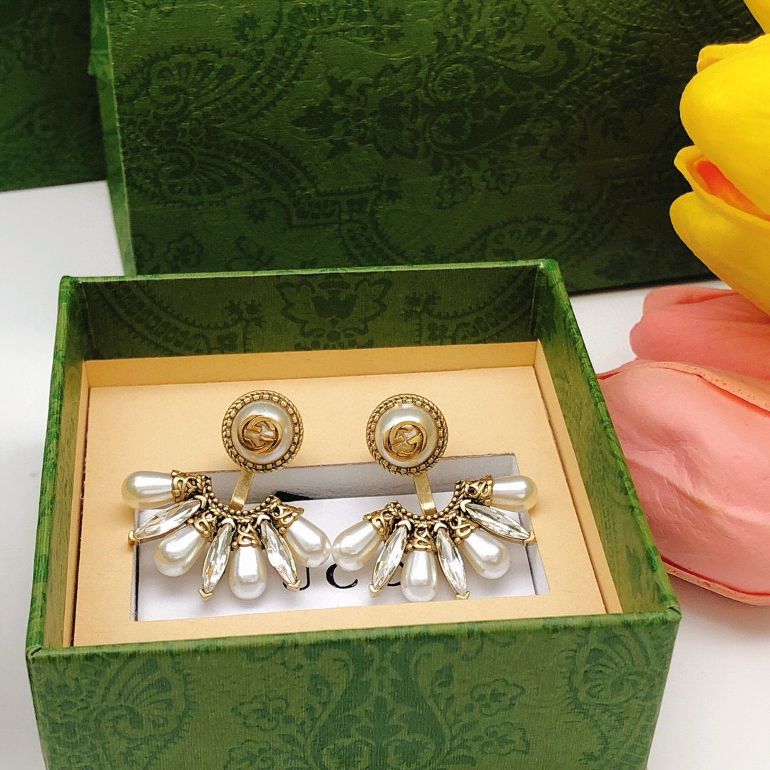 Martin Graham stud earrings in polished metal-tone – detail view
