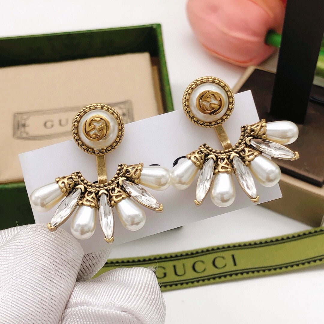 Martin Graham stud earrings in polished metal-tone – front product view