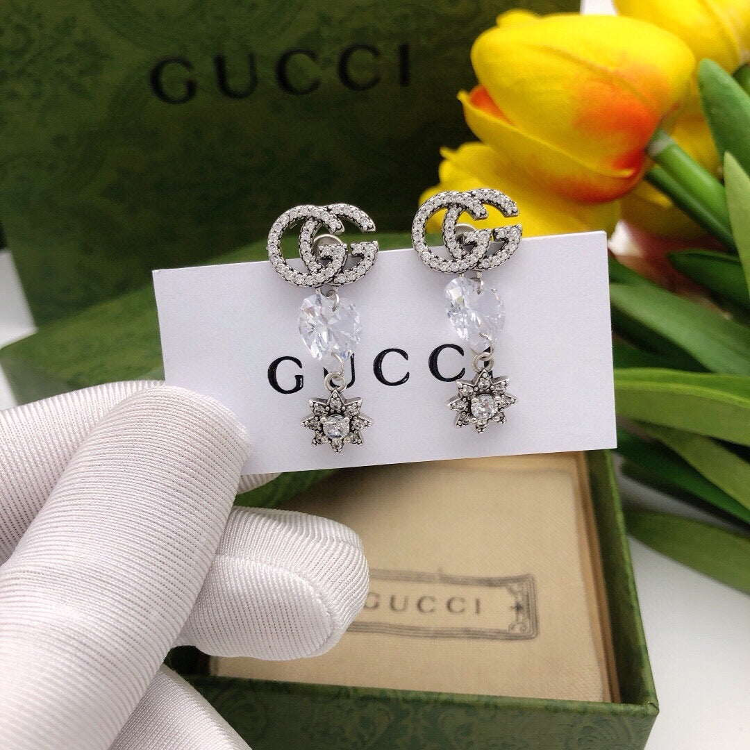 Martin Graham stud earrings in polished metal-tone – front product view